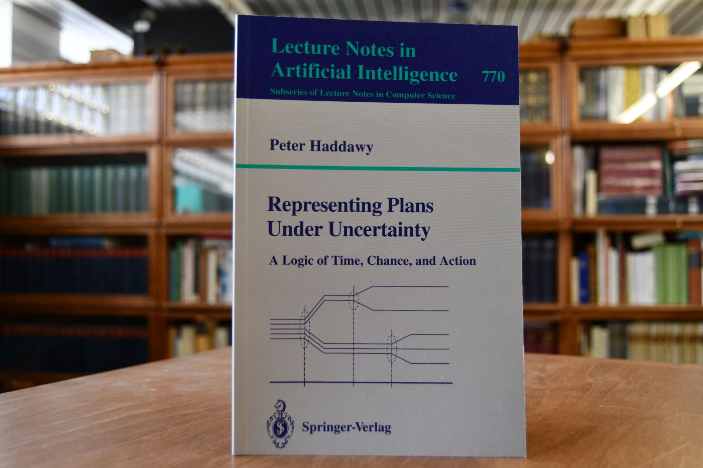 Representing plans under uncertainty. A logic of time, chance, and action.