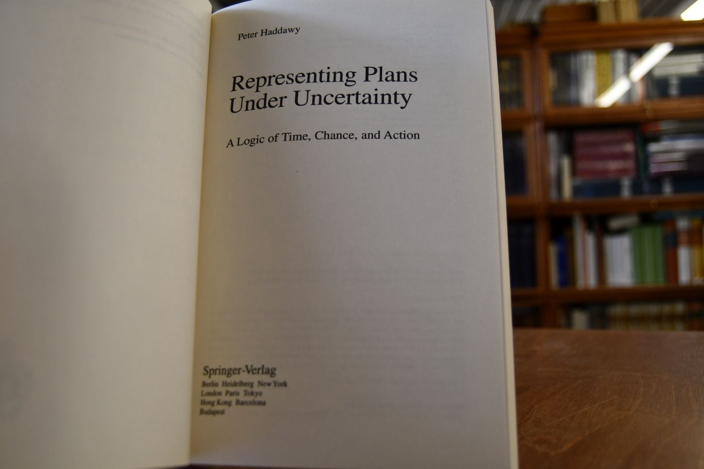 Representing plans under uncertainty. A logic of time, chance, and action.