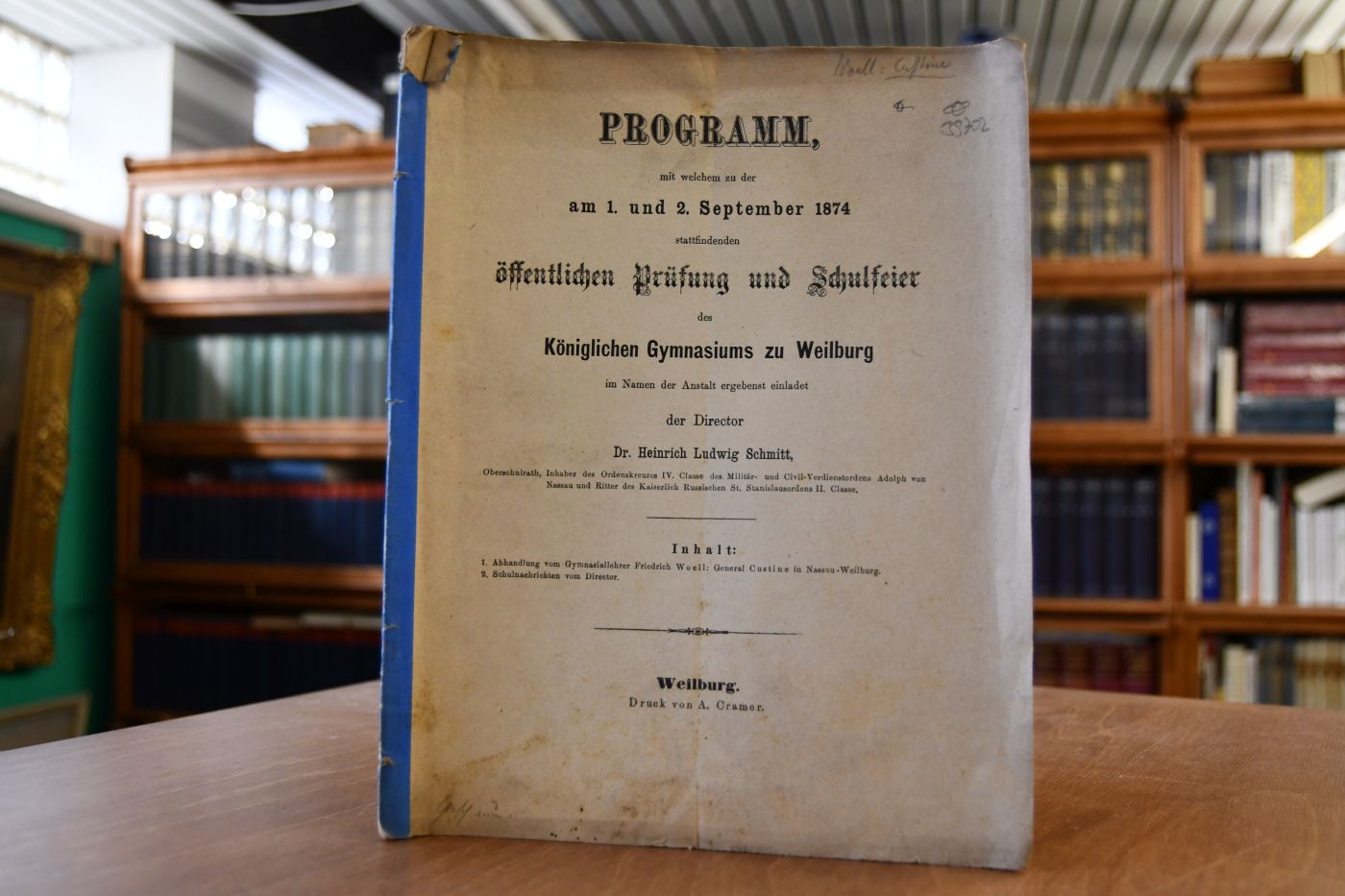 Programm, mit welchem zu der am 1. und 2. September 1874 stattfindenden öffentlichen Prüfung und Schulfeier des Königlichen Gymnasiums zu Weilburg im Namen der Anstalt ergebendst einladend der Director Heinrich Ludwig Schmitt.
